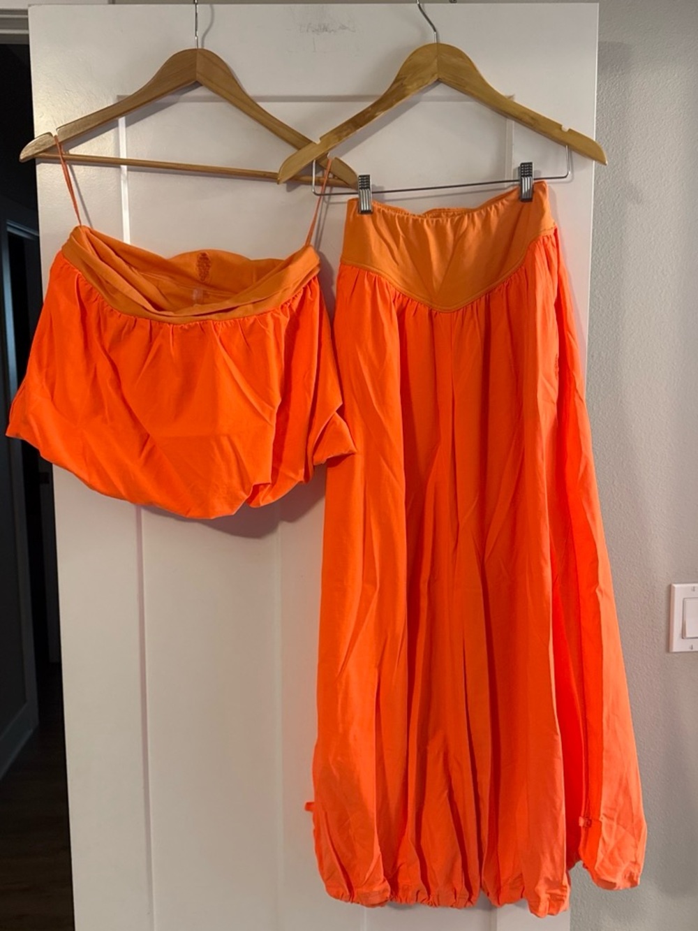 FP Movement Orange Women's strapless top, pants set.